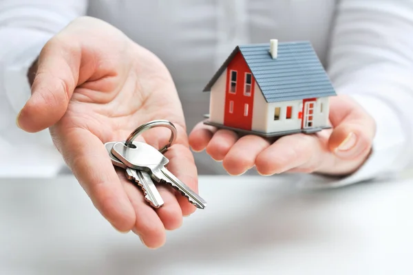 depositphotos 21515189 stock photo agent with house model and